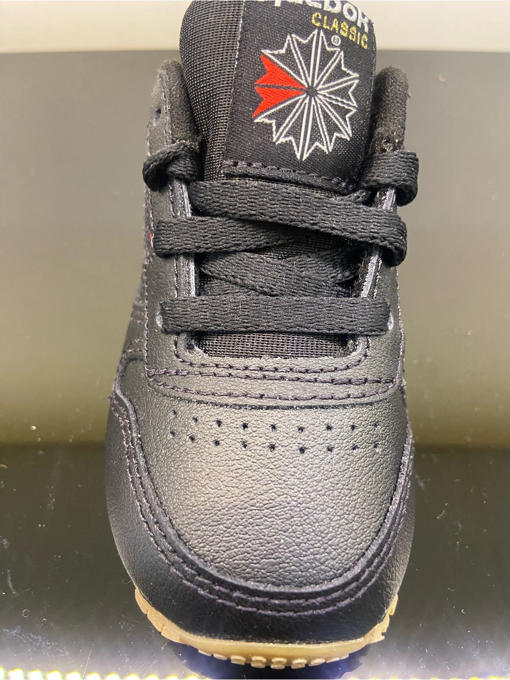 Reebok Kids Black Leather Sneaker with Red Accent